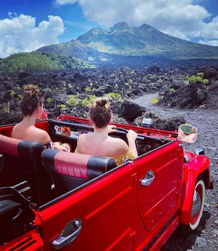 First-timers in the convertible, cruising past Tabanan's rice terraces.